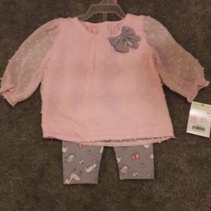 Pink blouse with grey bow and grey tights